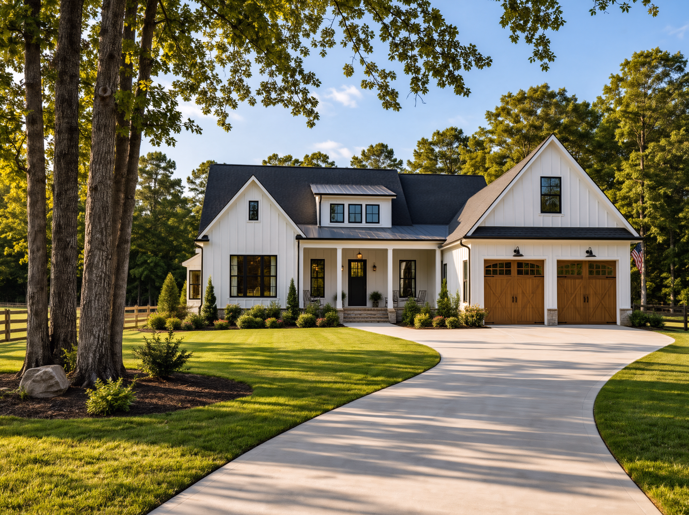 White farmhouse-style home with a central dormer, right garage and curving driveway