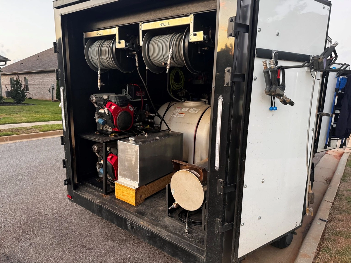 Rear view of the Clean and Fresh pressure washing rig with hoses and equipment secured for service