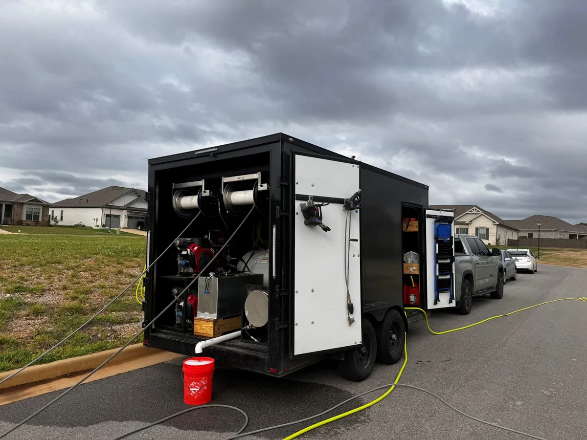 Clean and Fresh’s trailer with cleaning equipment and hose reels