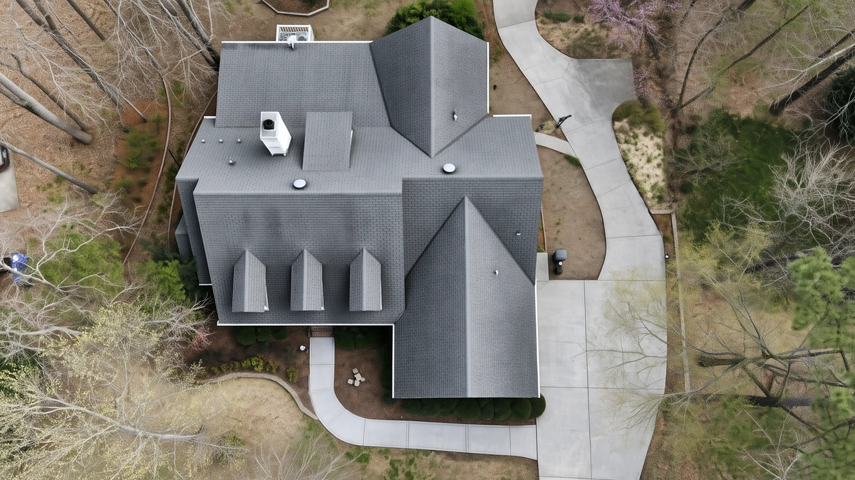 Matching overhead illustration with clean roof slopes, driveway and front path
